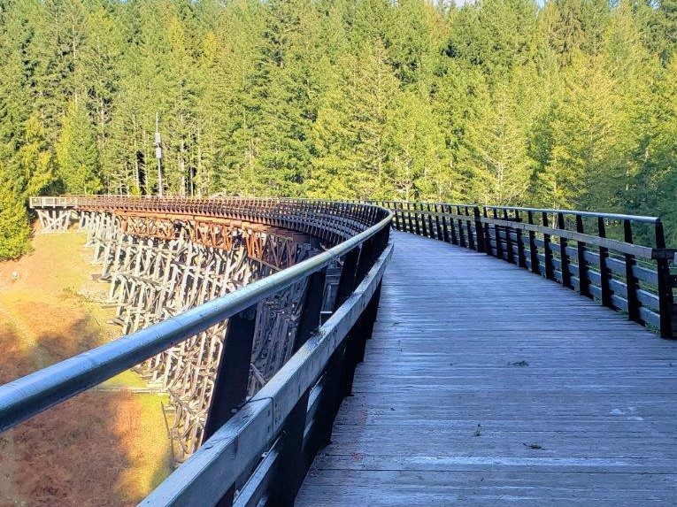 Showing how the Kinsole Tresle bridge curves and is made of wood and large walkway on top