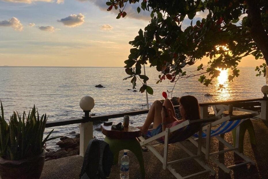 Woman in lounger enjoying sunset at a Koh Jum resort