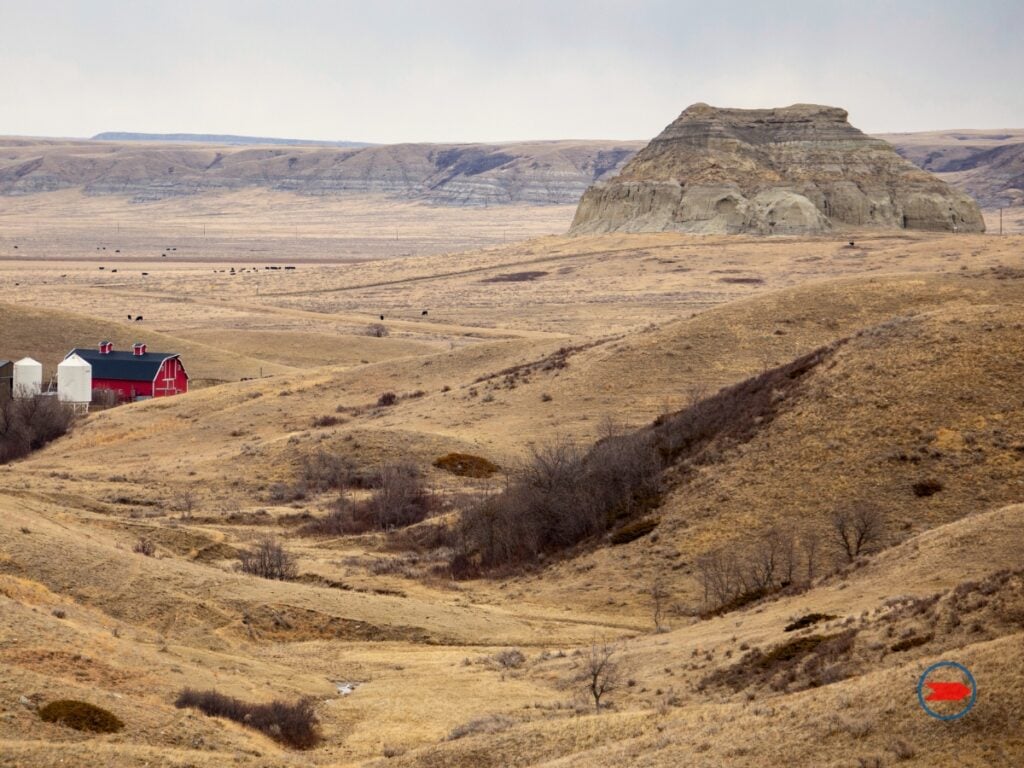 Castle Butte near a farm on the prairies