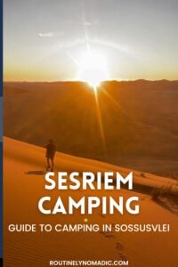 Hiker on a sand dune at sunset