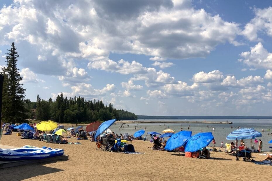 Waskesiu Lake Main Beach with umbrellas