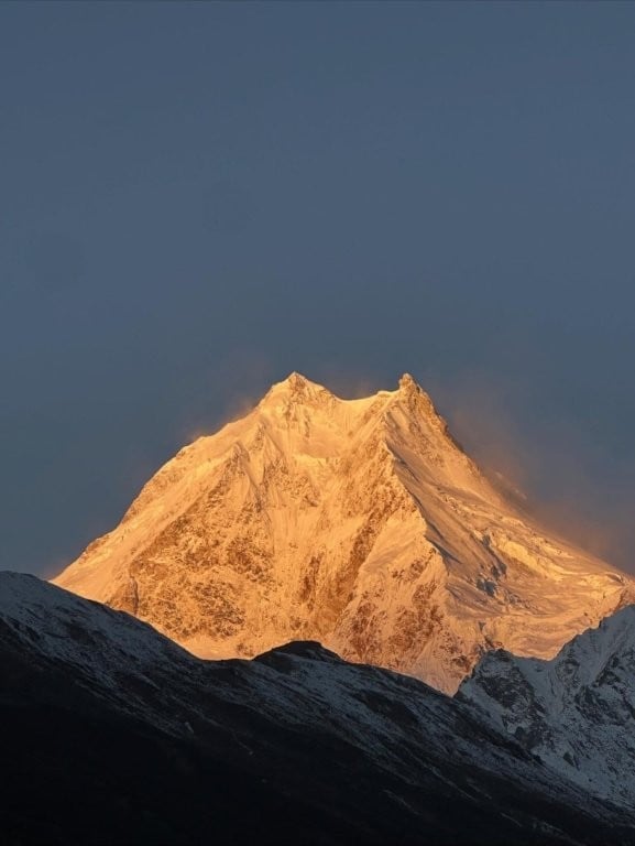 Snowy Himalayan peak at sunrise