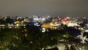 Lake at night surrounded by lit up buildings