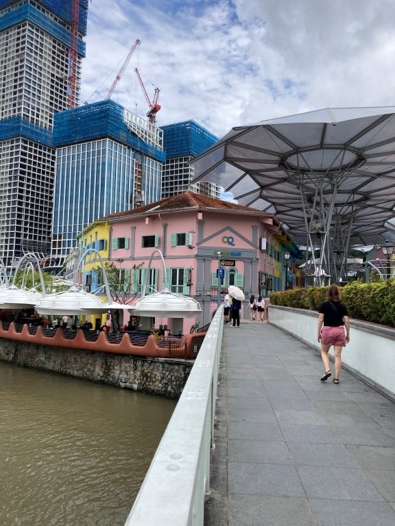 Woman approaching Central Quay on one of the best Singapore walking itineraries
