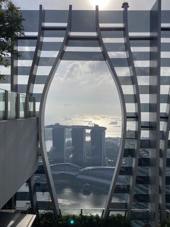View of Marina Bay Sands through concave opening on Capita Spring SkyDeck