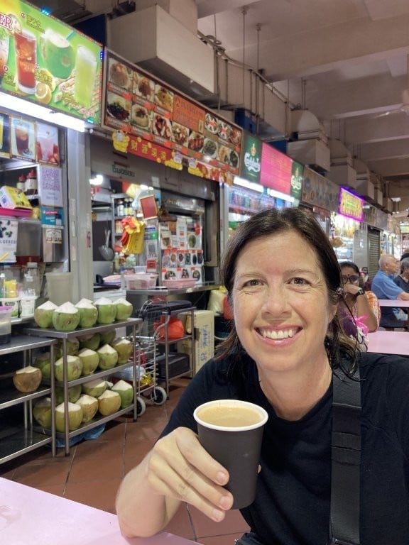 Woman drinking tea in the Tekka Centre