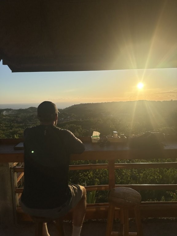 Man watching sunset in a Nusa Penida restaurant