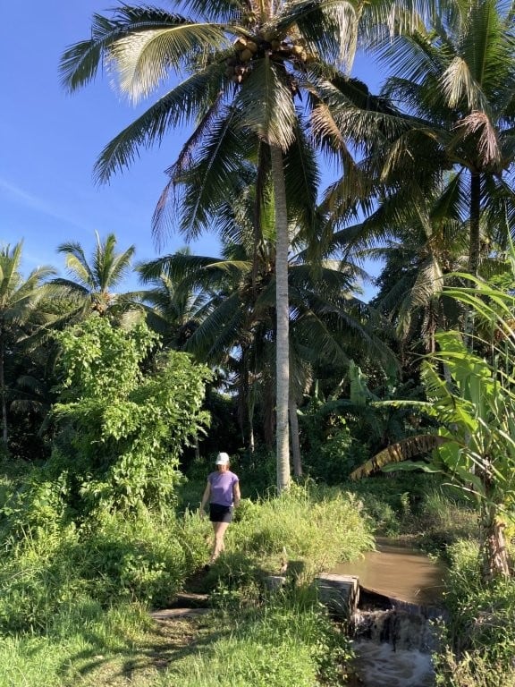 Woman walking on a jungle path