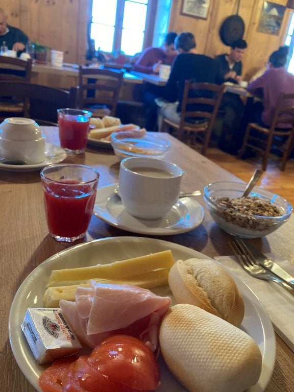 Breakfast of bread, ham, cheese and tomatoes