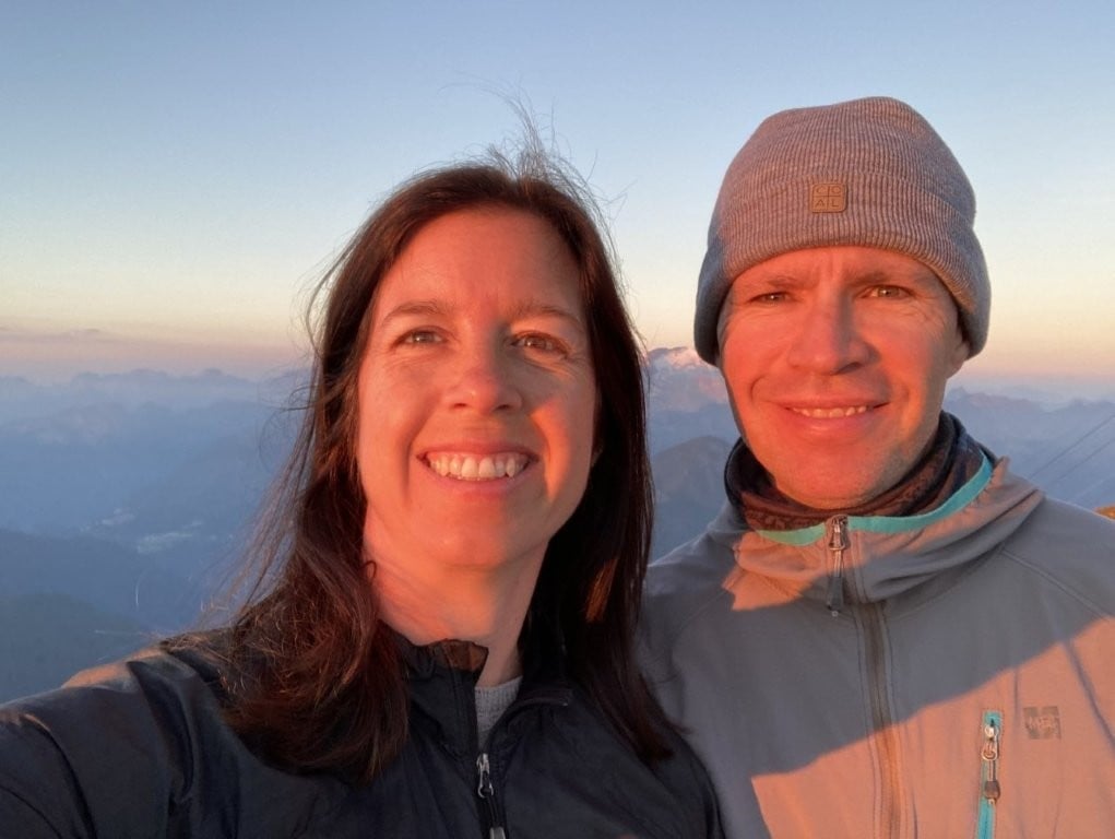 Couple selfie with mountain range in background