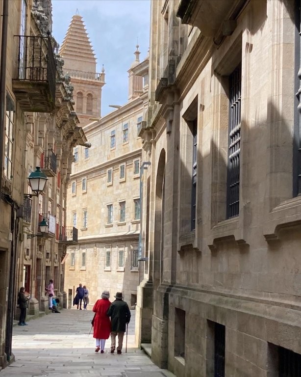 Elderly couple walking in Santiago de Compostela old town