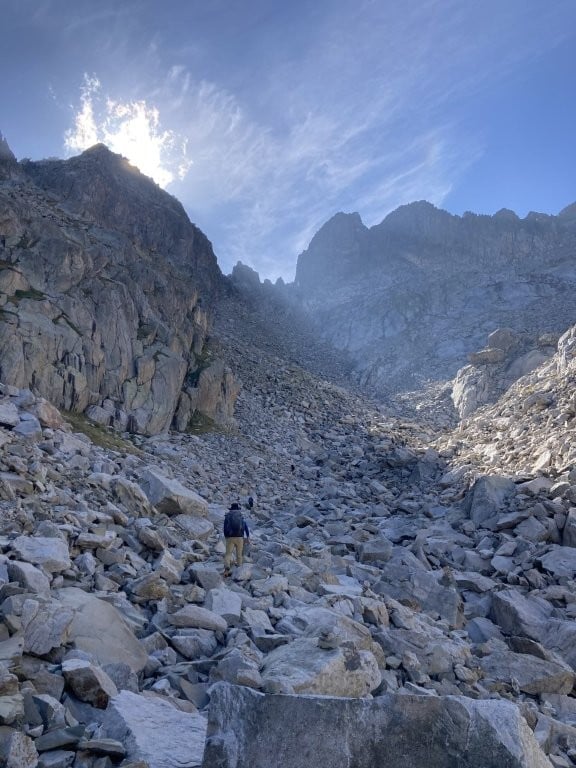 Man hiking through rockslide