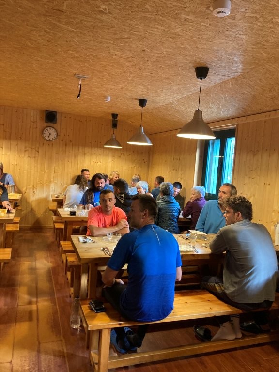People sitting at tables in dining room