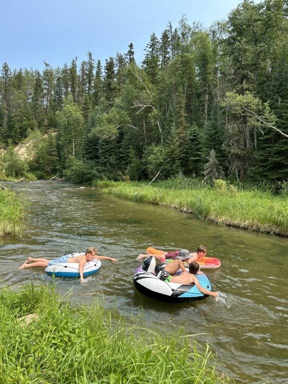 Group of kids setting off on a river float
