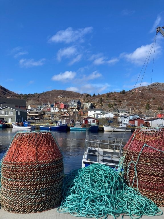 Fishing rope and baskets on dock near coastal village