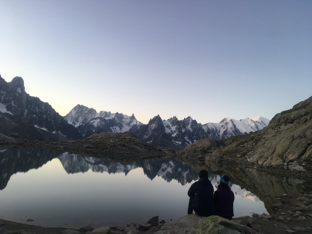 Couple next to a calm mountain lake