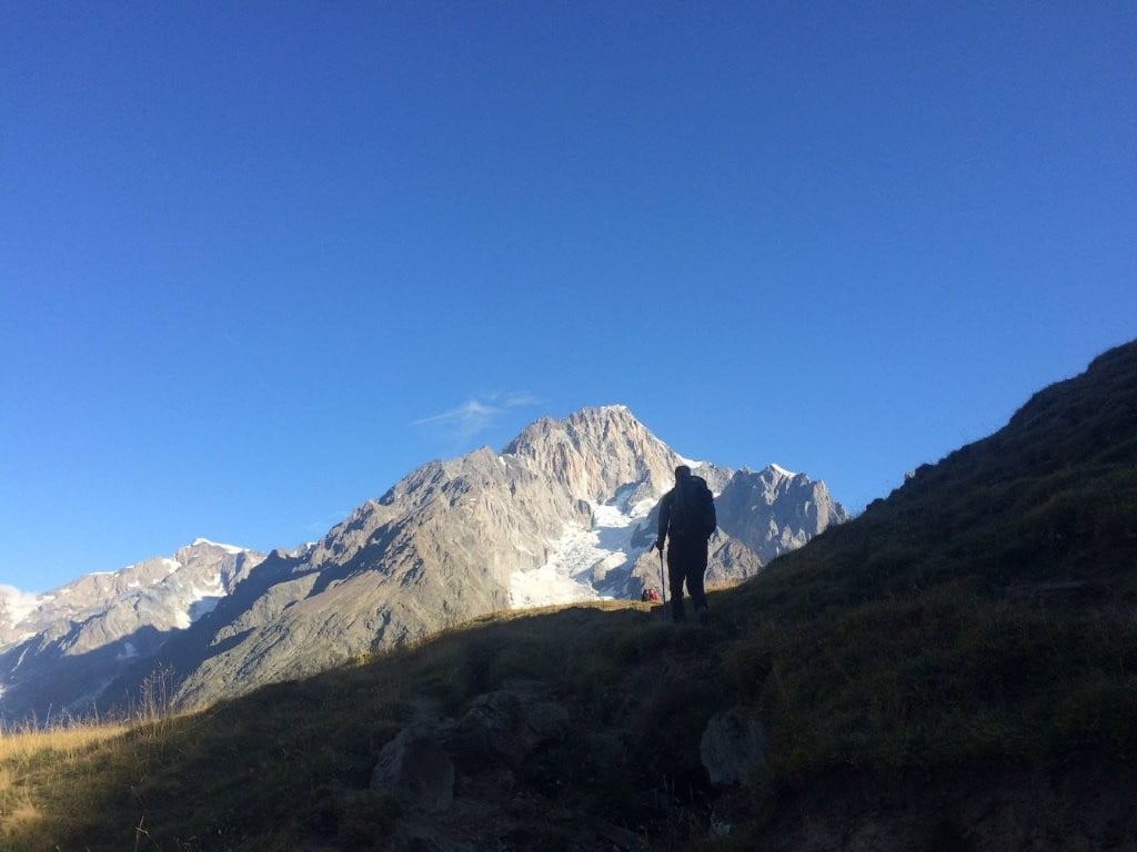 Hiker silhouetted against the mountains