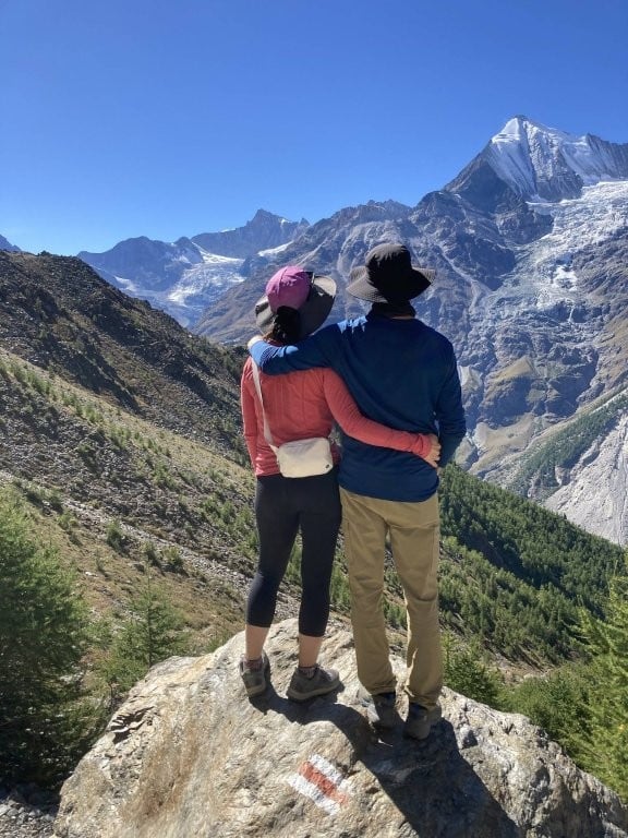 Couple on a rock in the Swiss mountains