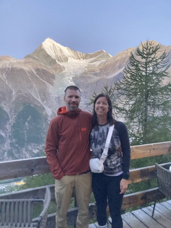 Couple selfie in front of snow-covered mountains