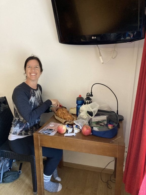 Woman making lunch at a hotel desk