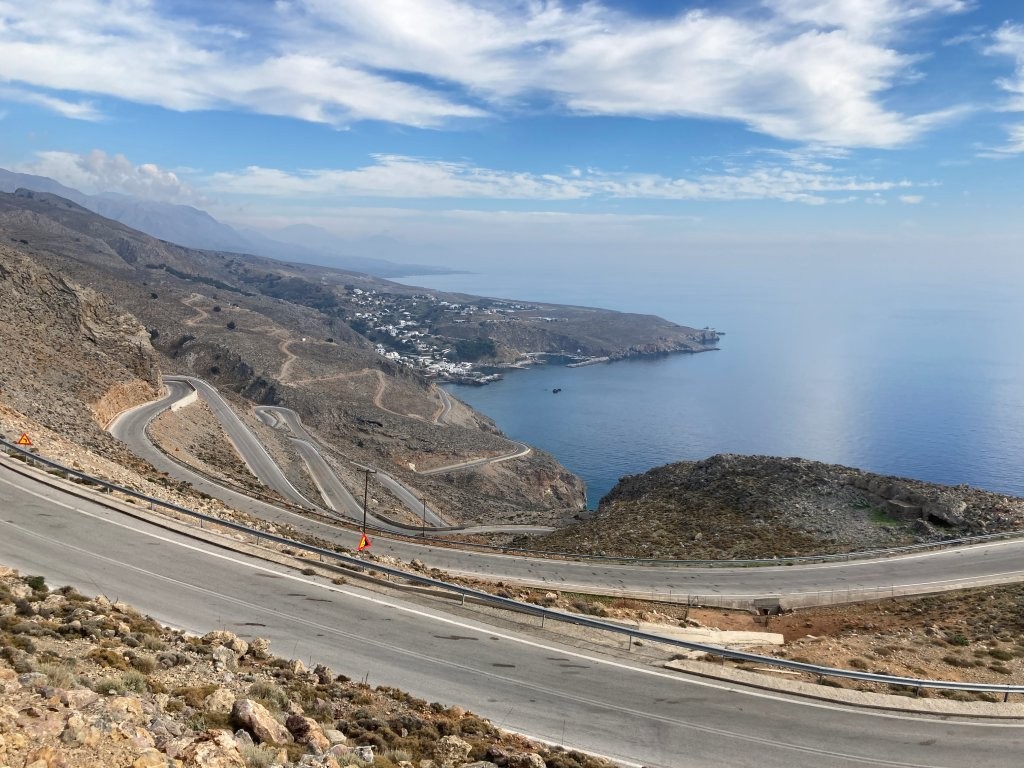 Narrow road winding up the hill overlooking the Mediterranean