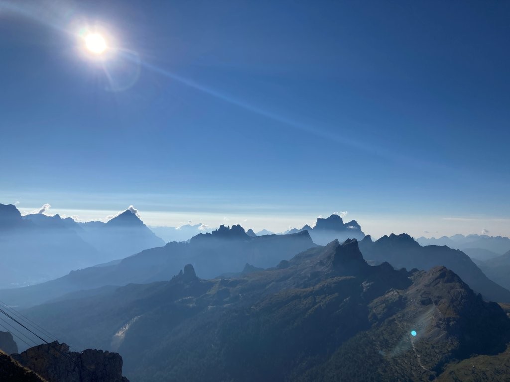 Jagged mountain peaks silhouetted against a blue sky