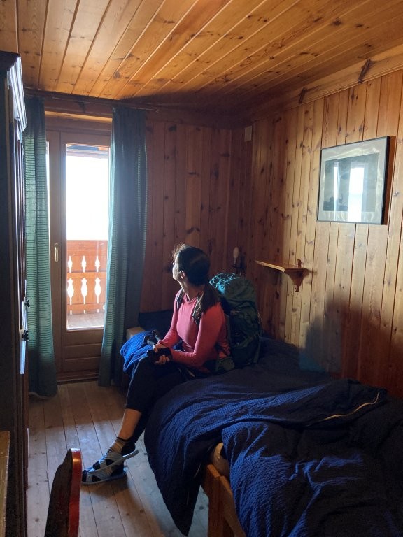 Woman in small room in mountain hut