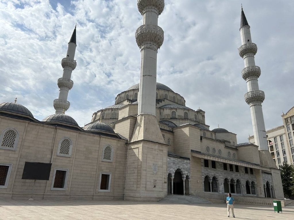 Woman in front of the Turkish mosque in Bishkek