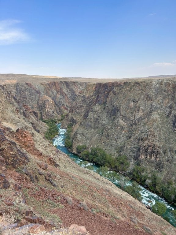 Narrow canyon with a river running through it