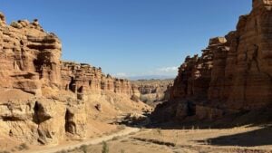 Rocky canyon with dirt road down the middle