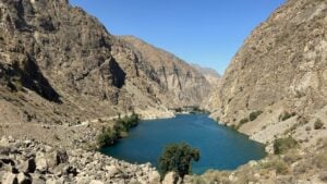 Small blue lake surrounded by rocky hills